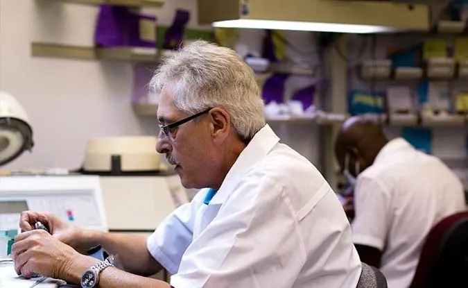 Technicians at their benches in the practice's in-house laboratory.